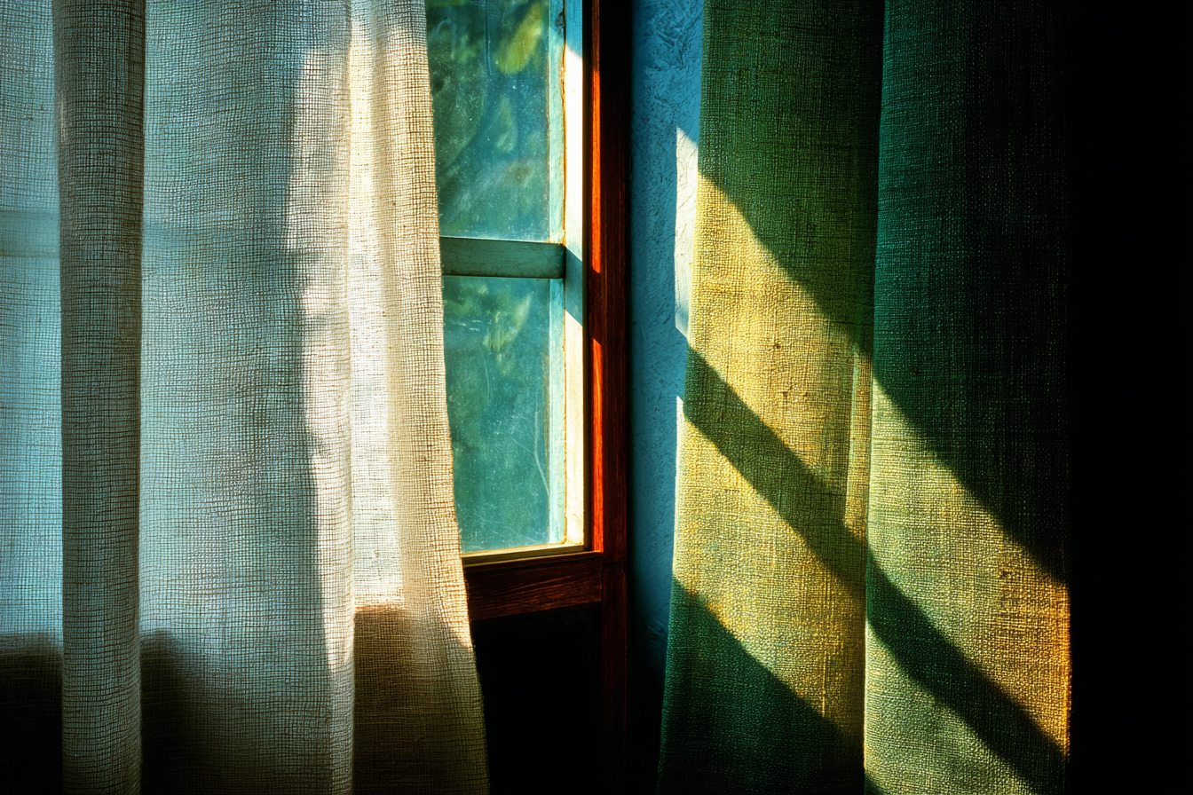 A single thin curtain of translucent ivory linen backlit by a faint warm source, the light barely edging through the fabric